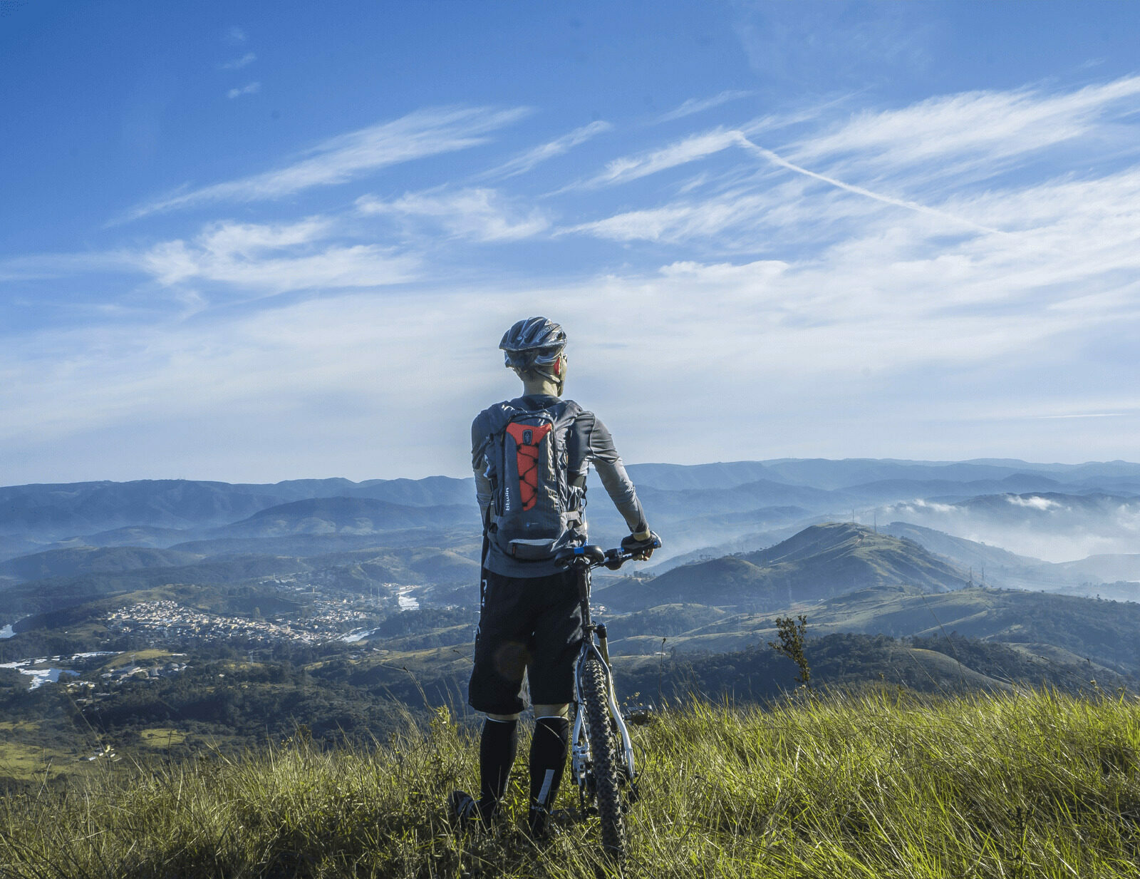 Mountain biker looking over mountains.